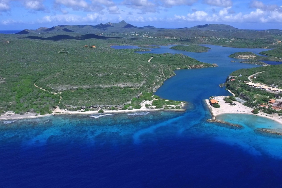 To the left of the bay's mouth; San Nicolas lot with 984 yards of coral beach shoreline.