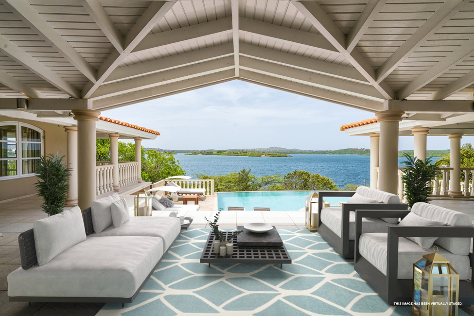 Covered terrace with beam ceiling, virtually staged.