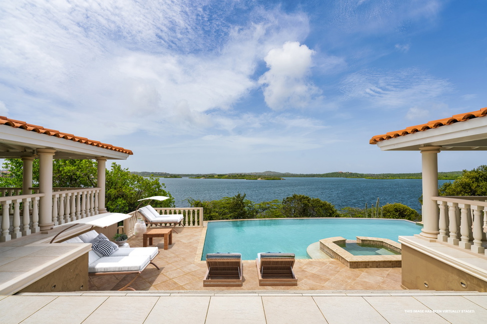 Deck with infinity pool & jacuzzi, virtually staged.