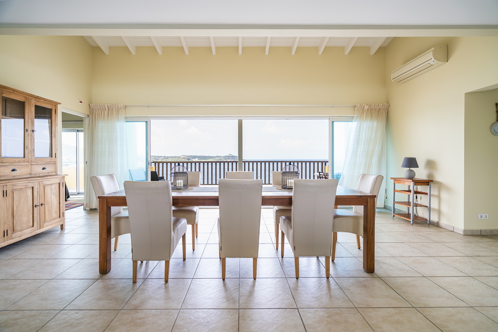 The covered terrace on the dining room provides inspiring views of Curacao's landmarks; Fort Beekenburg & quarantine house.