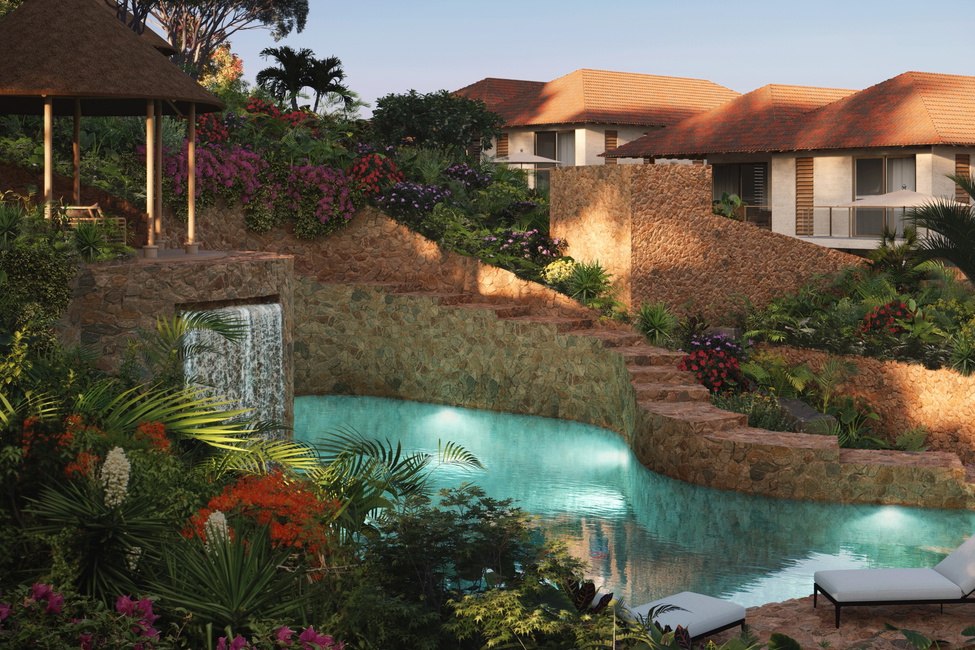 The lush, designed landscaping surrounding the communal swimming pool featuring waterfall and palapa of Blue Bay Hills Residences located in Blue Bay.